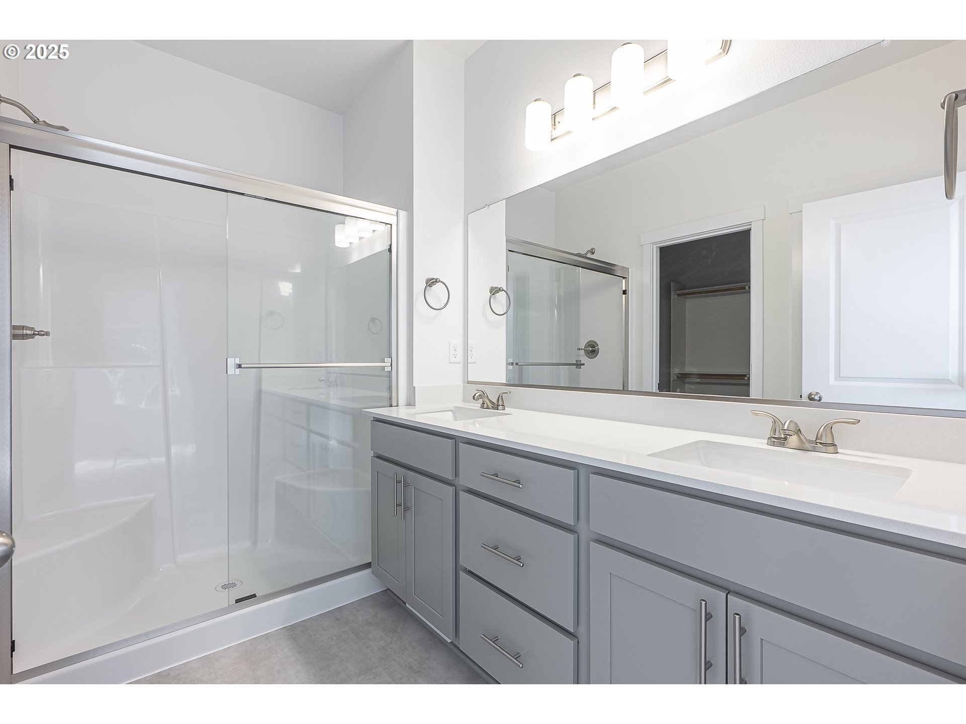 702 Tigerlily Street Silverton, OR 97381 - Photo 14 of 31 a bathroom with a double vanity sink mirror and double