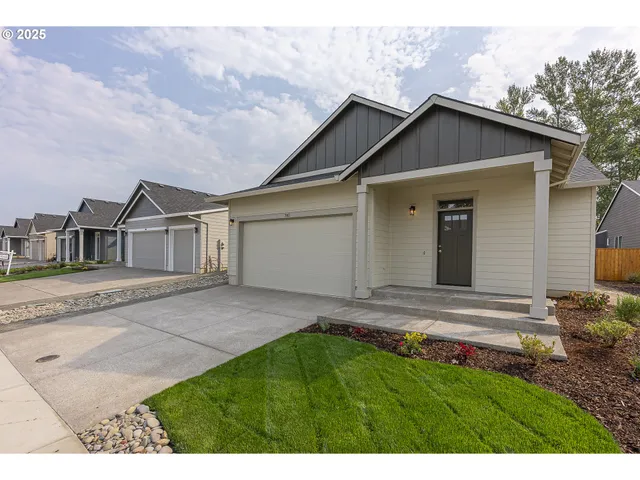 a view of front of house with a yard