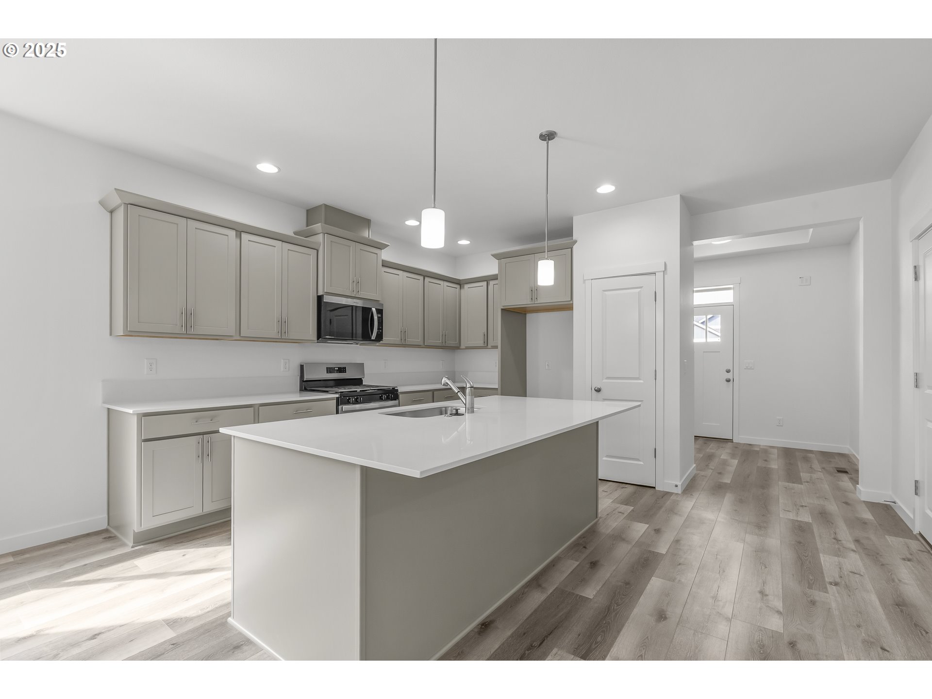 702 Tigerlily Street Silverton, OR 97381 - Photo 31 of 31 a kitchen with a sink a stove a refrigerator and a window