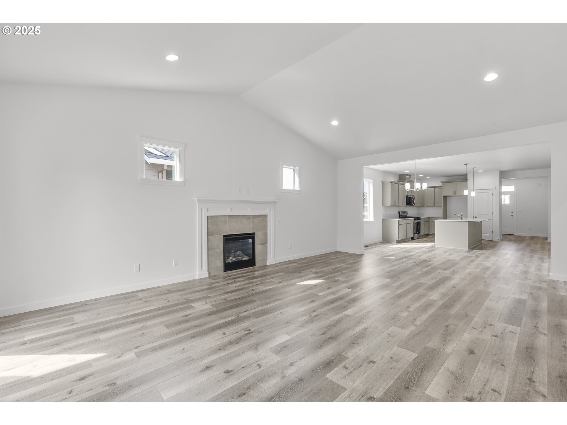 702 Tigerlily Street Silverton, OR 97381 - Photo 9 of 31 a view of empty room with wooden floor