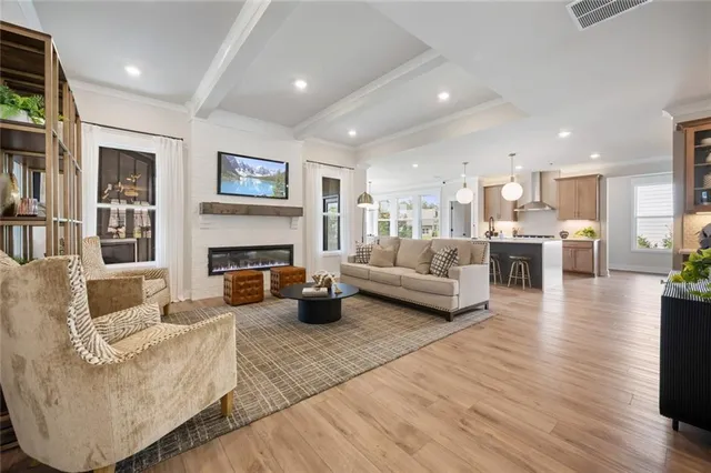 a living room with furniture and a potted plant