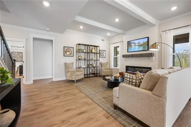 a spacious bathroom with a double vanity sink a mirror and a shower