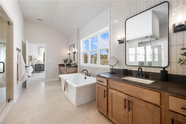 a dining room with furniture a chandelier and wooden floor