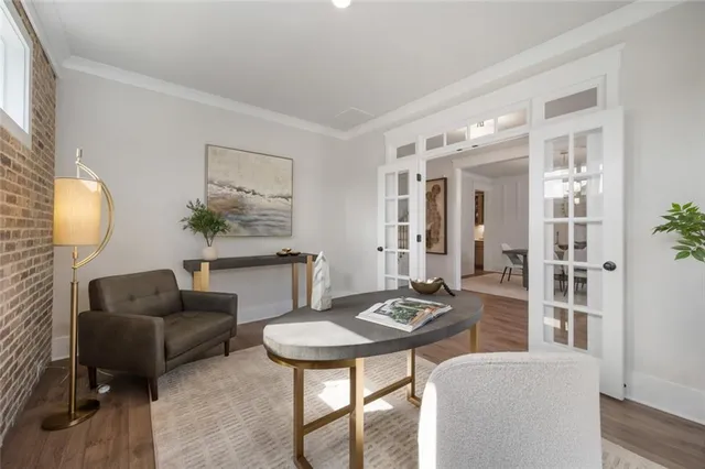 a front view of a house with a garden and plants