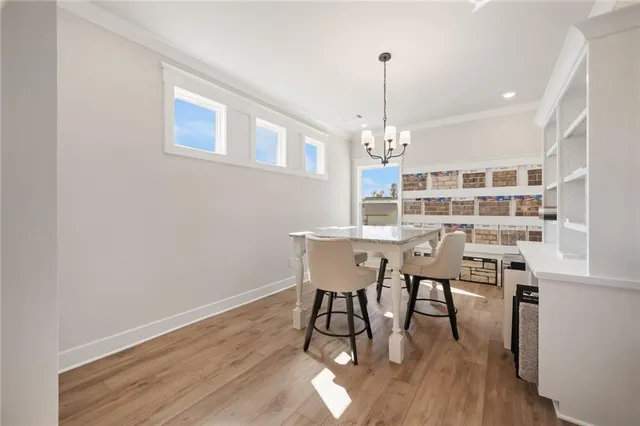 a view of a house with a yard and potted plants