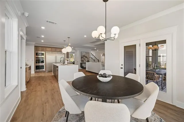 a view of a lake with a palm tree next to a road