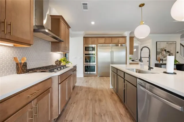 a bathroom with a double vanity sink a mirror and bathtub