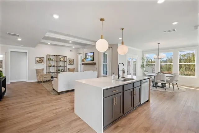 a bathroom with a double vanity sink mirror and shower