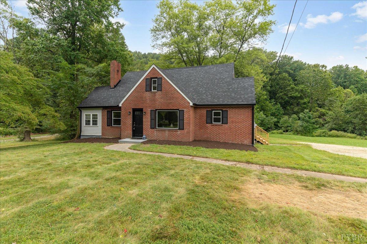 15 Cannery Loop Lovingston, VA 22949 - Photo 3 of 60 a front view of a house with a yard