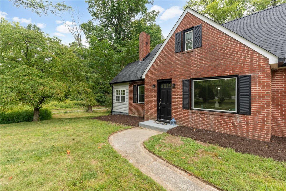 15 Cannery Loop Lovingston, VA 22949 - Photo 4 of 60 a front view of a house with a garden and yard