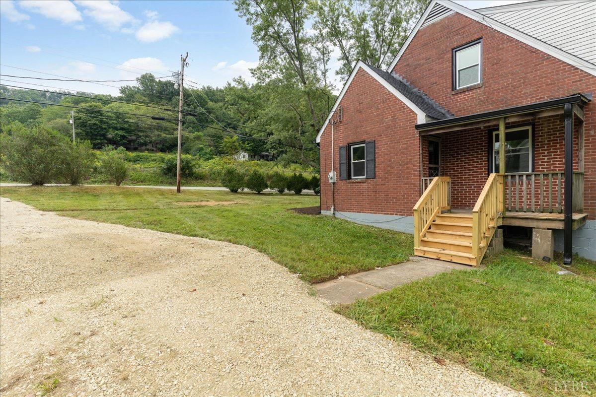 15 Cannery Loop Lovingston, VA 22949 - Photo 48 of 60 a front view of a house with garden