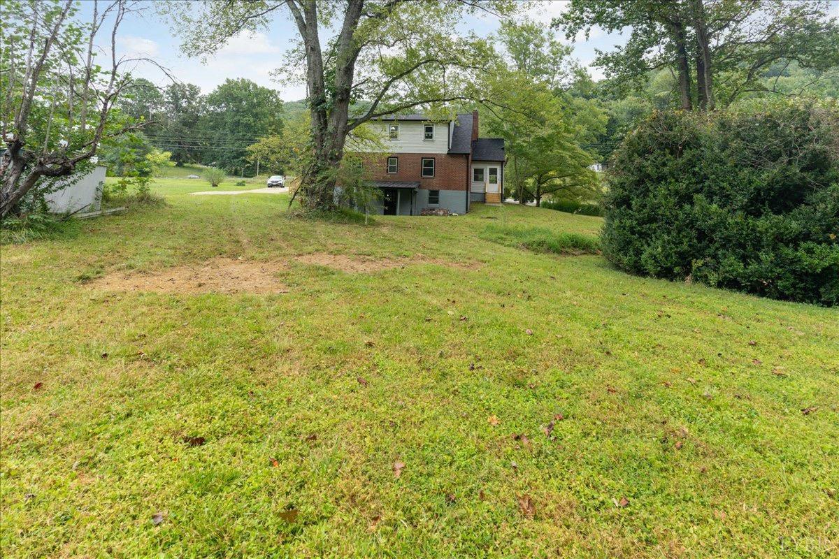 15 Cannery Loop Lovingston, VA 22949 - Photo 50 of 60 a view of a house with a garden and trees