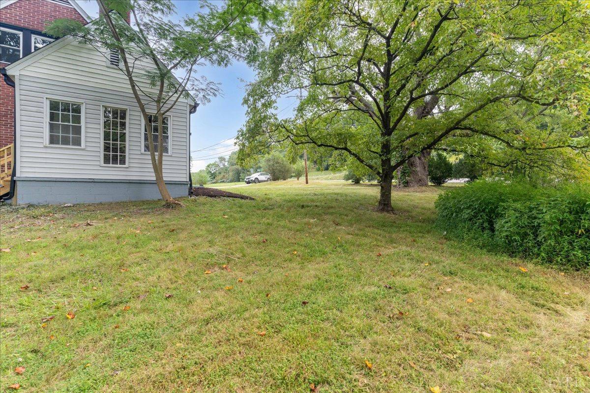 15 Cannery Loop Lovingston, VA 22949 - Photo 54 of 60 a view of a yard with a house and large trees