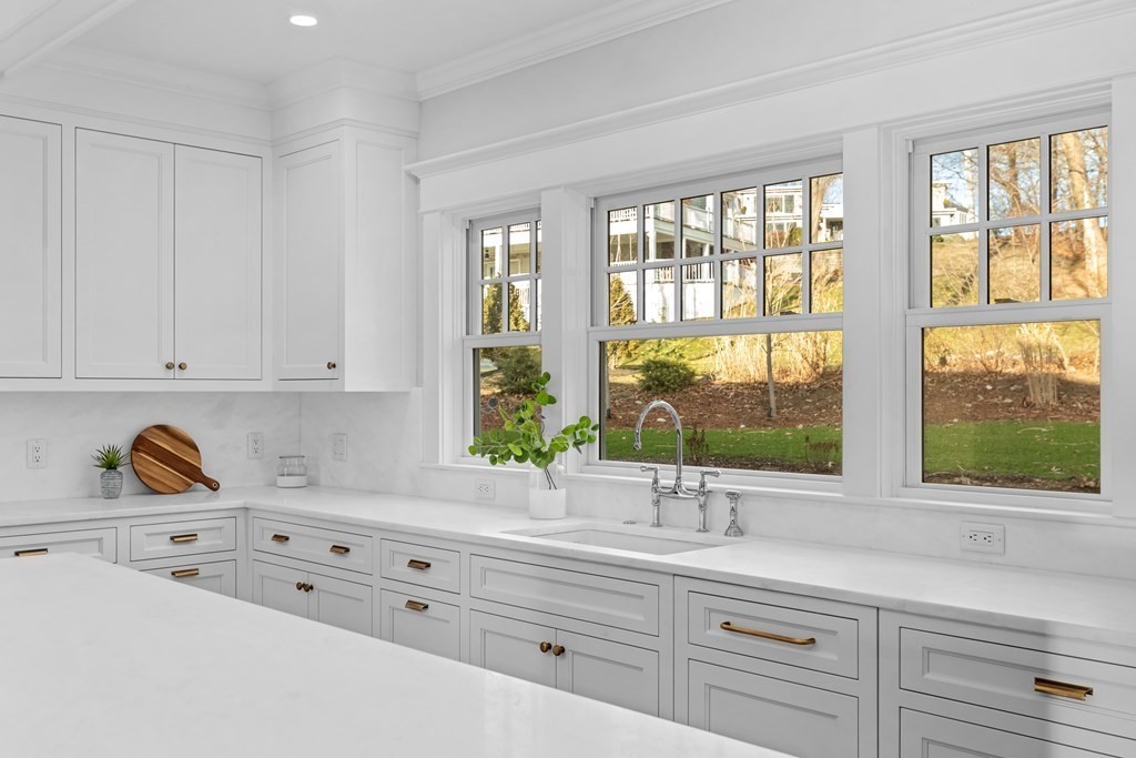 68 Bel Air Road Hingham, MA 02043 - Photo 3 of 36 a kitchen with cabinets a window a sink and a window