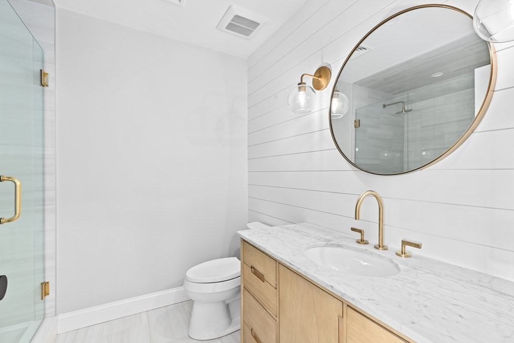 68 Bel Air Road Hingham, MA 02043 - Photo 32 of 36 a bathroom with a sink and mirror