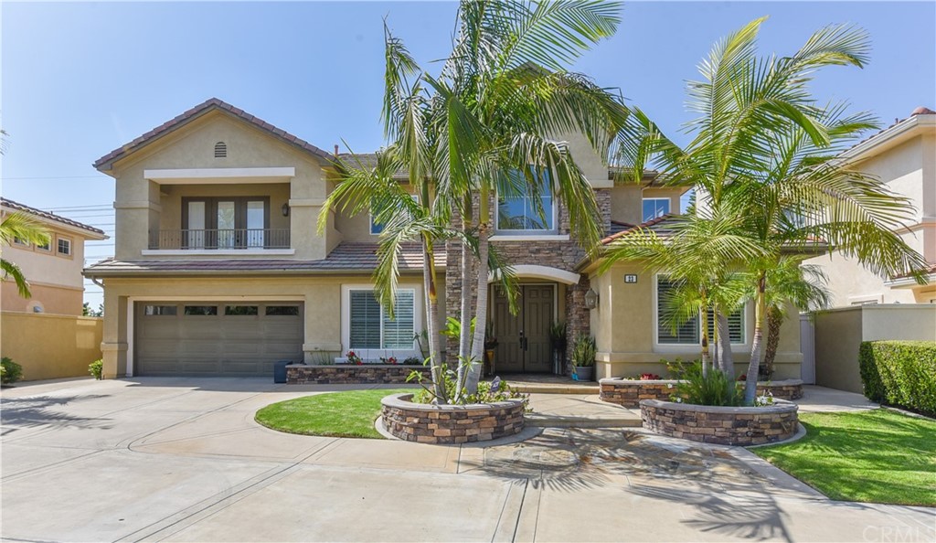 23 Benavente Irvine, CA 92606 - Photo 1 of 44 a front view of a house with a garden