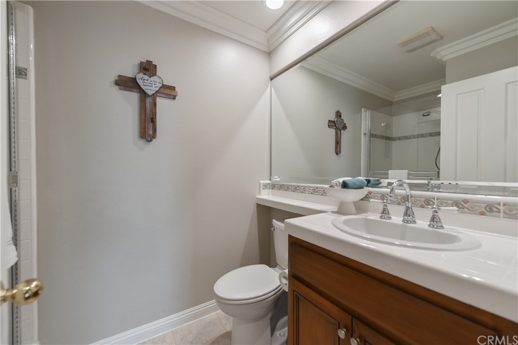 23 Benavente Irvine, CA 92606 - Photo 16 of 44 a bathroom with a sink toilet and mirror