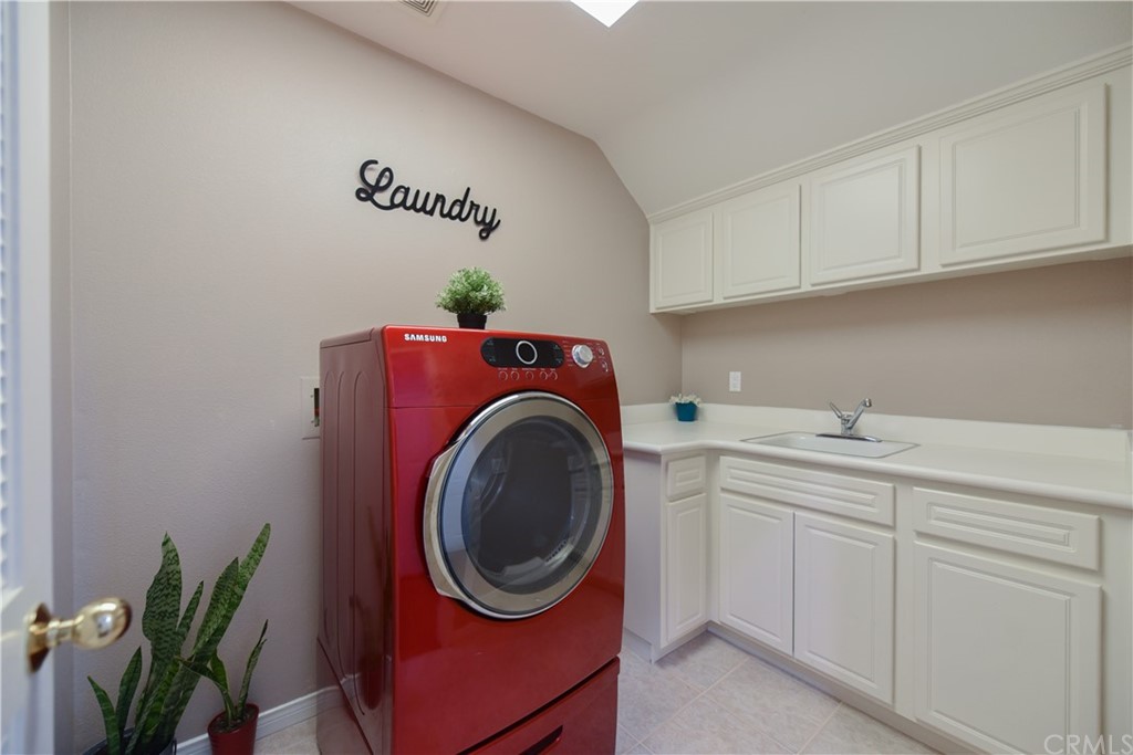 23 Benavente Irvine, CA 92606 - Photo 17 of 44 a utility room with sink dryer and washer