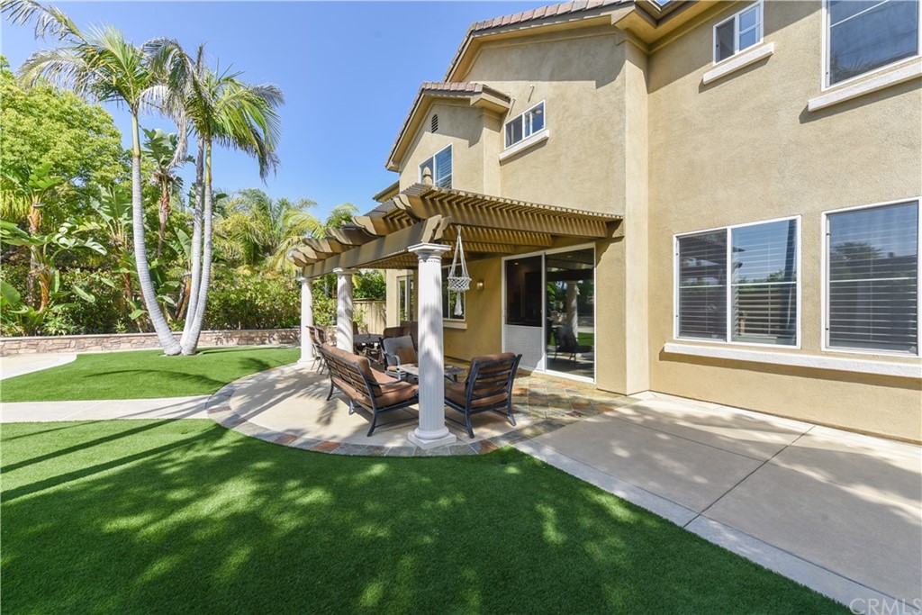 23 Benavente Irvine, CA 92606 - Photo 18 of 44 a view of a house with backyard porch and sitting area
