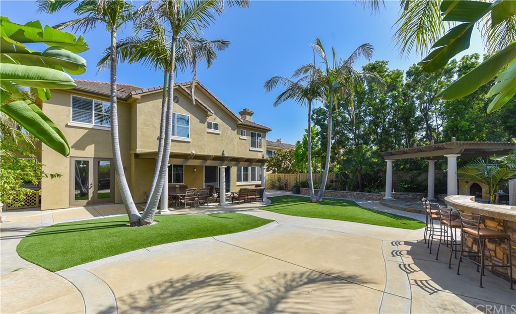 23 Benavente Irvine, CA 92606 - Photo 22 of 44 a front view of house with yard and green space