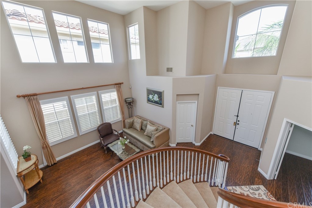 23 Benavente Irvine, CA 92606 - Photo 29 of 44 a view of an empty room with wooden floor and a window