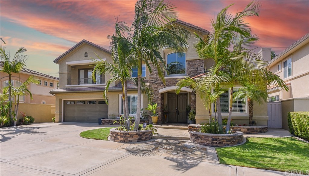 23 Benavente Irvine, CA 92606 - Photo 3 of 44 a front view of a house with yard and tree s