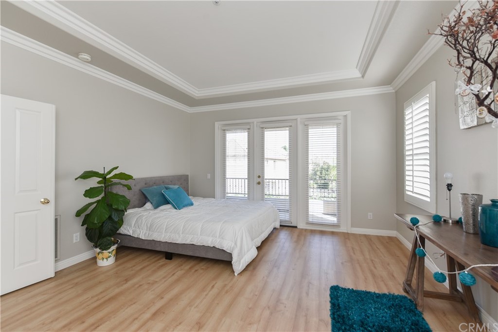 23 Benavente Irvine, CA 92606 - Photo 37 of 44 a room with a bed and a potted plant