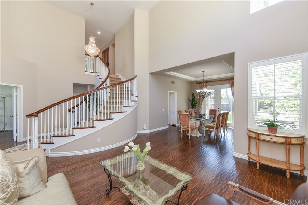 23 Benavente Irvine, CA 92606 - Photo 8 of 44 a view of a dining room with furniture window and wooden floor