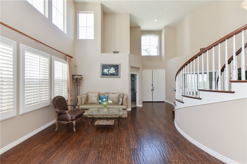 23 Benavente Irvine, CA 92606 - Photo 9 of 44 a living room with furniture and a wooden floor
