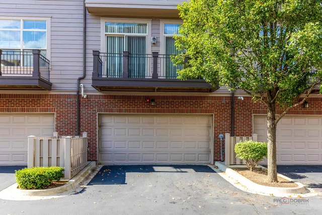 front view of a house with a tree