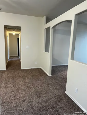 a view of a big room with closet and wooden door