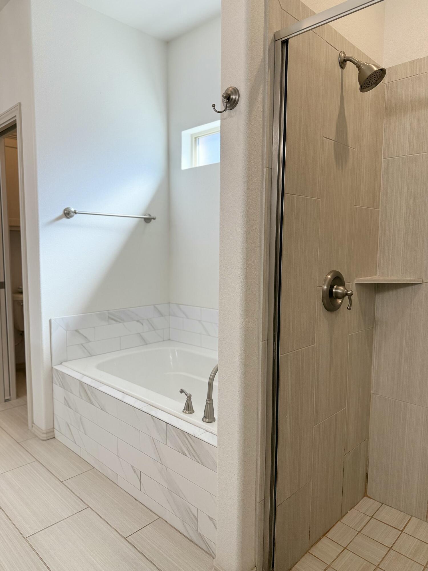 12202 Ithaca Avenue Lubbock, TX 79423 - Photo 14 of 28 a bathroom with a bathtub