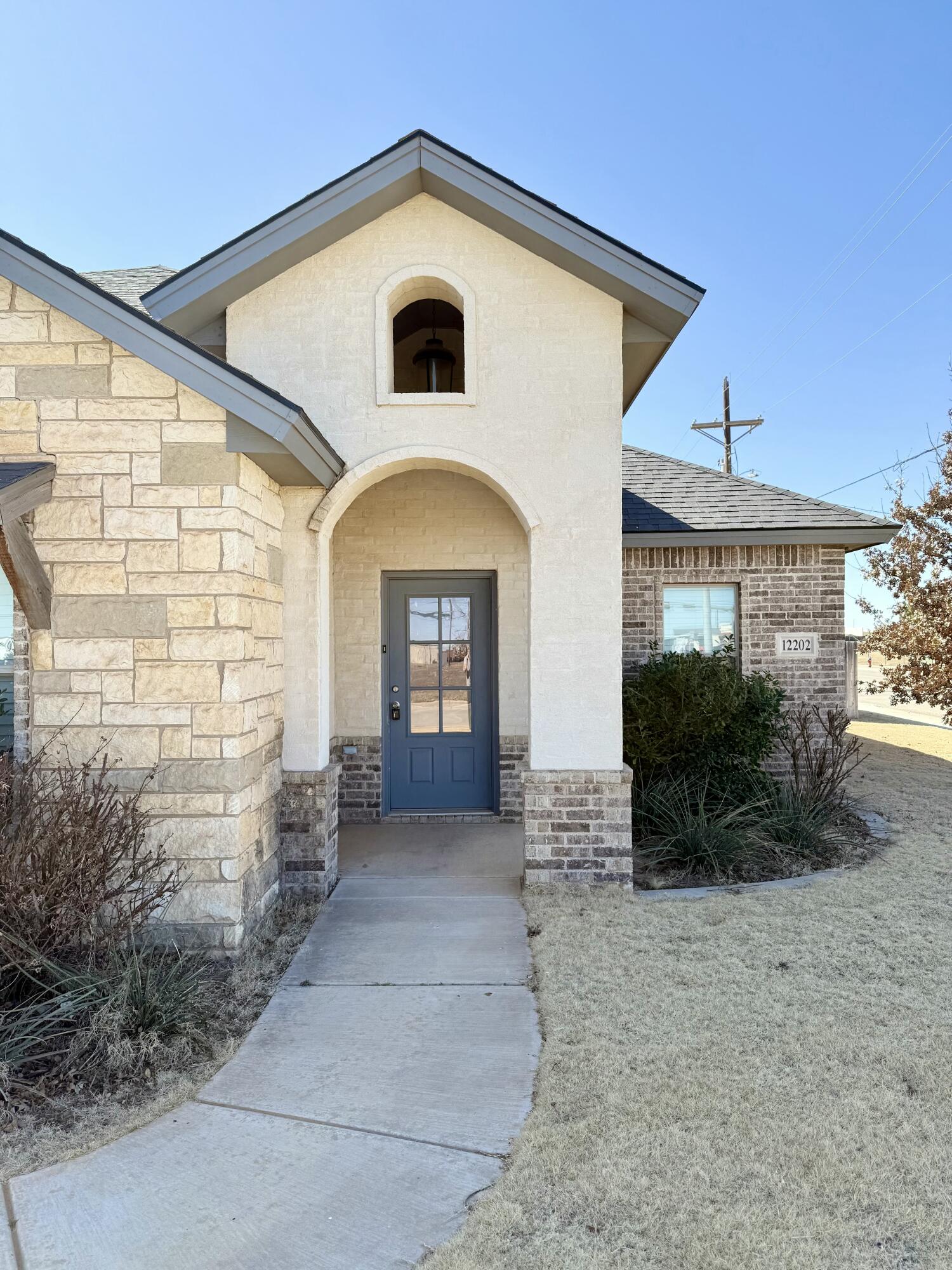 12202 Ithaca Avenue Lubbock, TX 79423 - Photo 2 of 28 a front view of a house with a yard