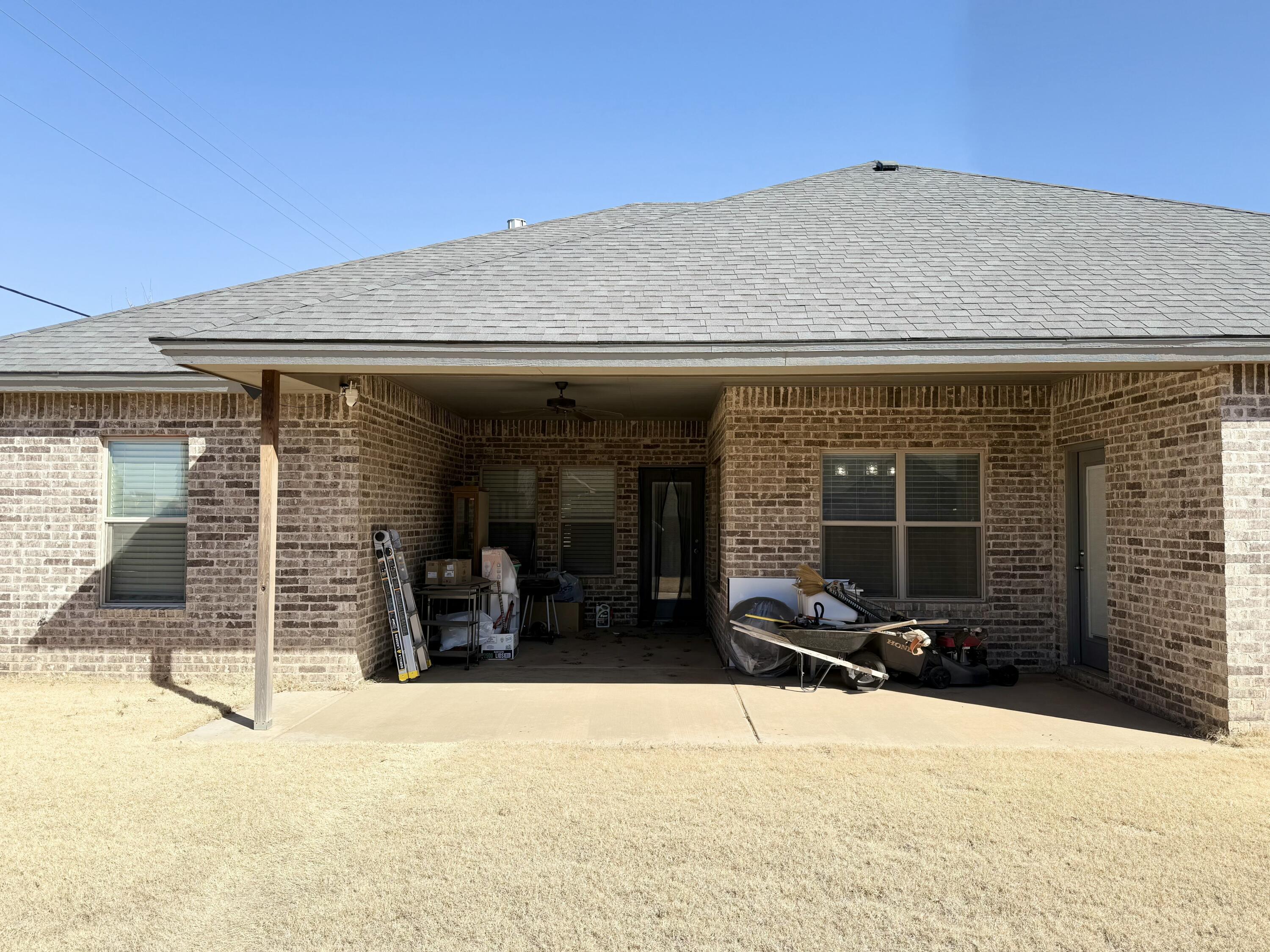 12202 Ithaca Avenue Lubbock, TX 79423 - Photo 27 of 28 front view of a house with a yard