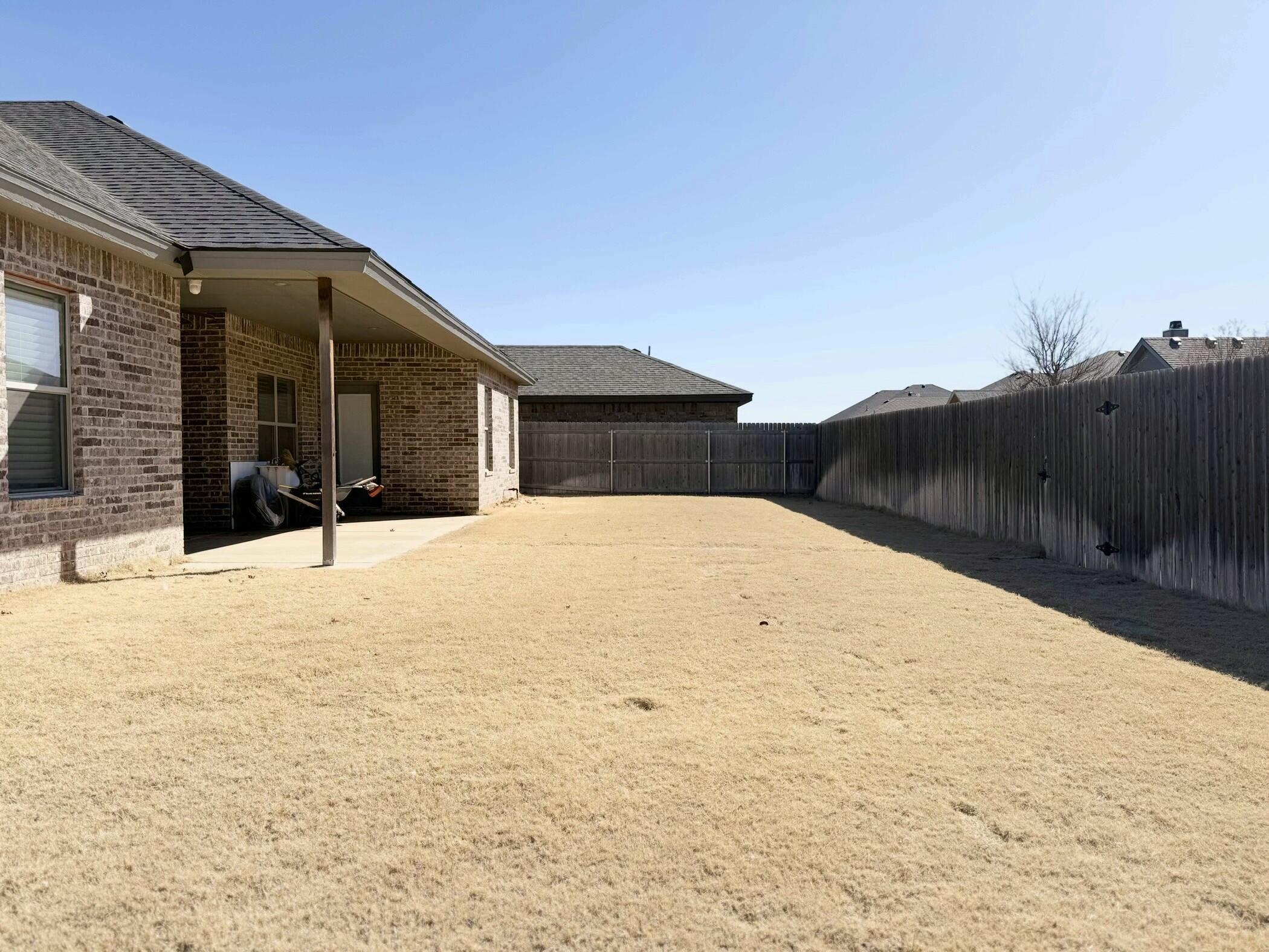 12202 Ithaca Avenue Lubbock, TX 79423 - Photo 28 of 28 a view of white house with a yard