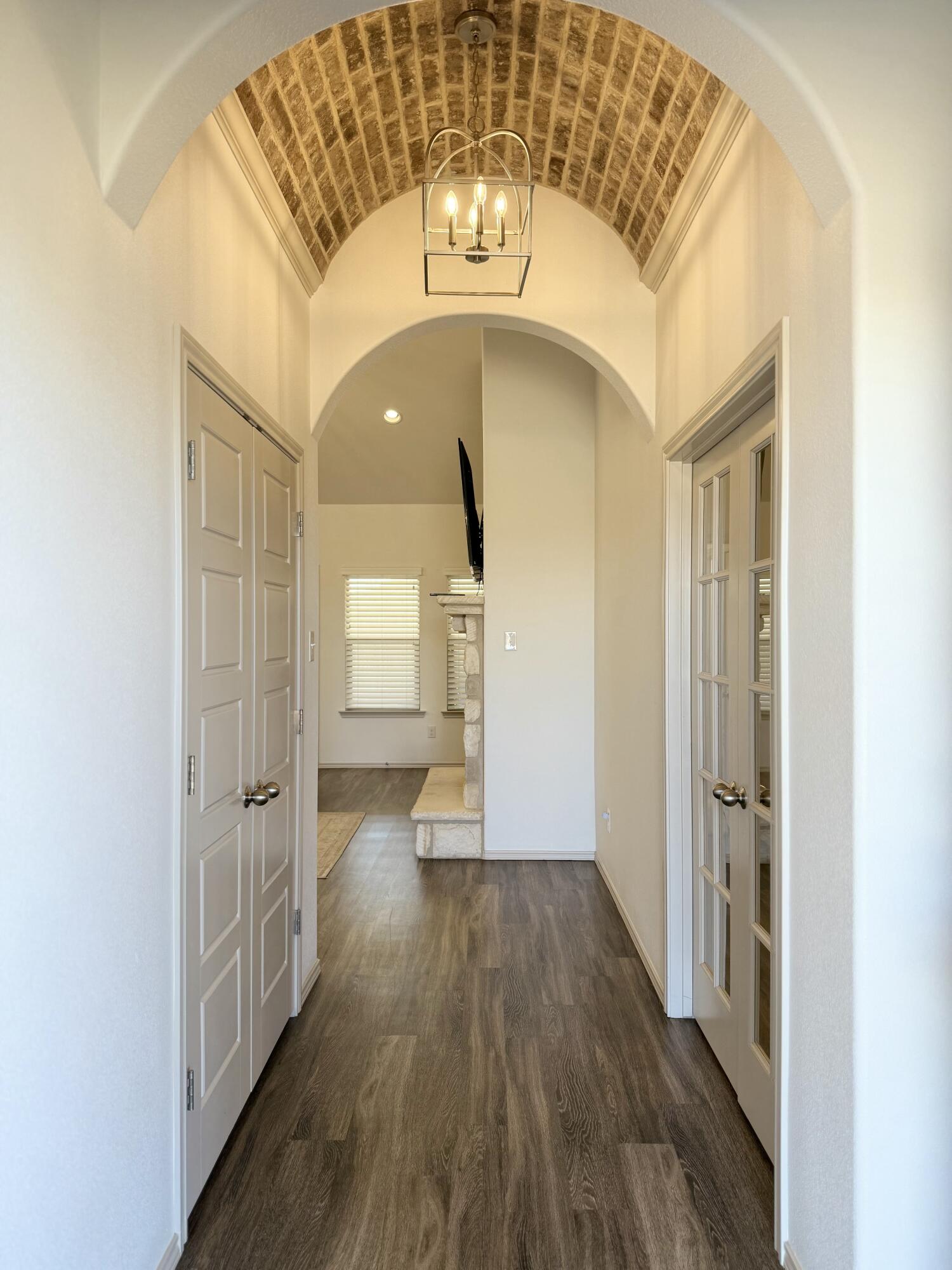 12202 Ithaca Avenue Lubbock, TX 79423 - Photo 3 of 28 a view of entryway with wooden floor