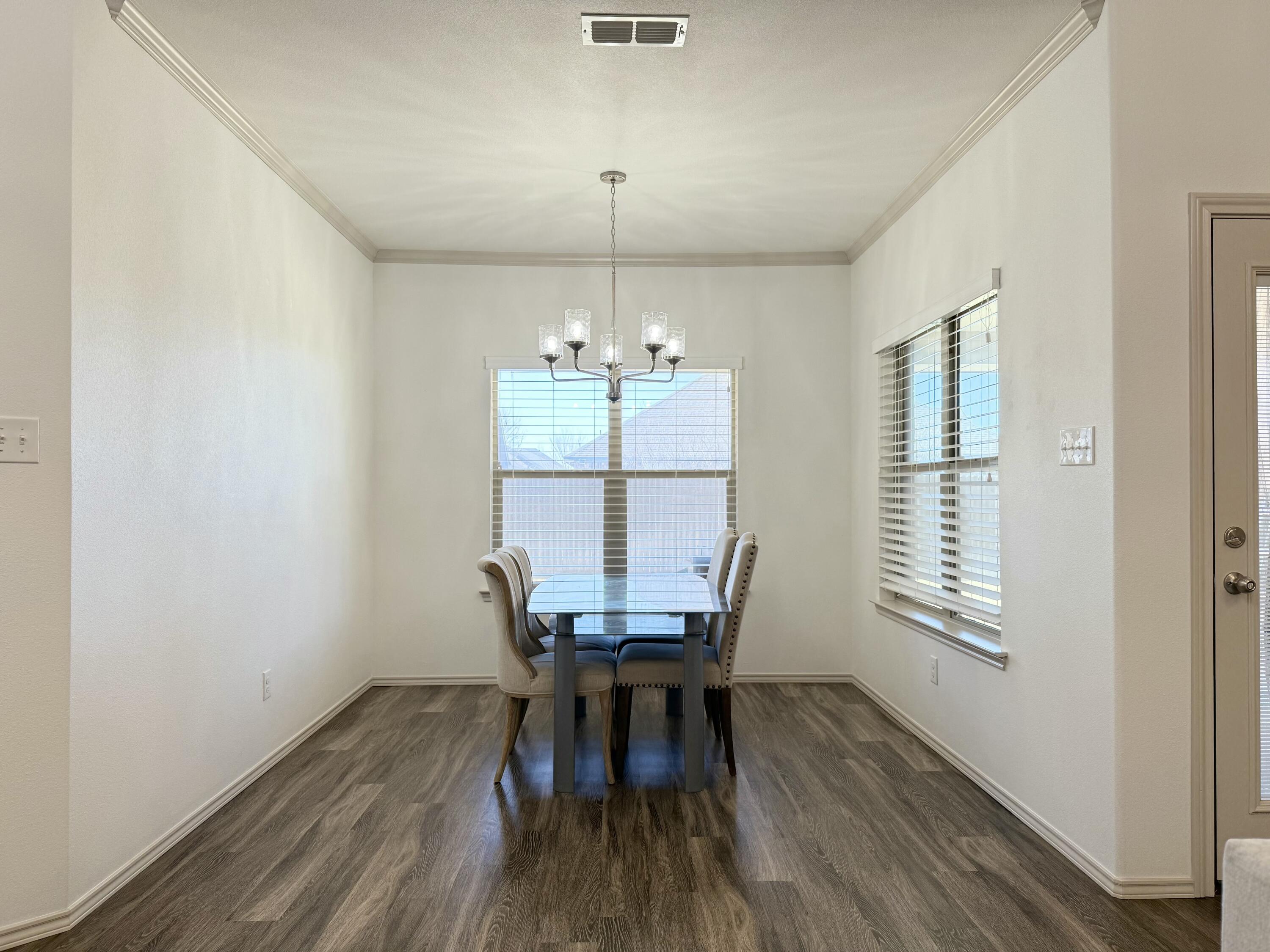 12202 Ithaca Avenue Lubbock, TX 79423 - Photo 9 of 28 a workspace room with furniture and wooden floor