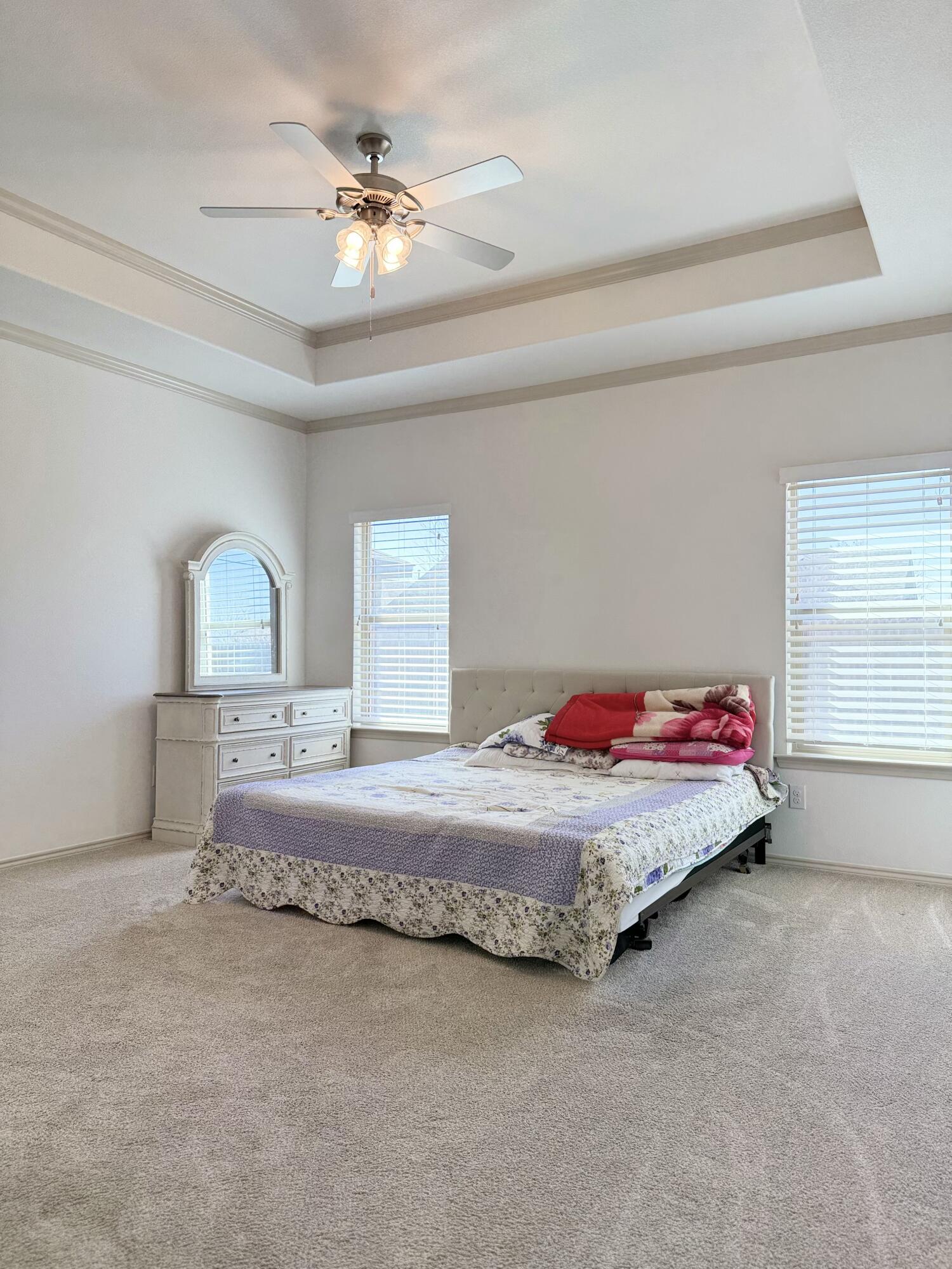 12202 Ithaca Avenue Lubbock, TX 79423 - Photo 10 of 28 a bedroom with a bed and window