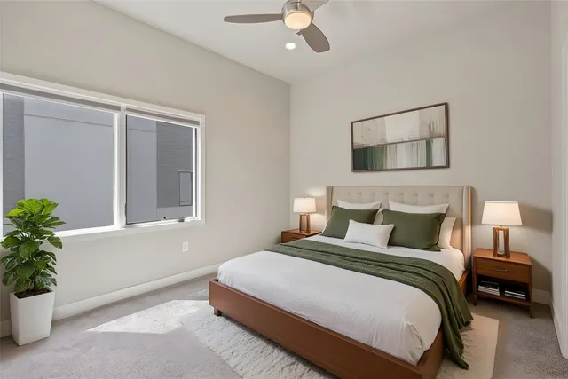 a bedroom with bed and window