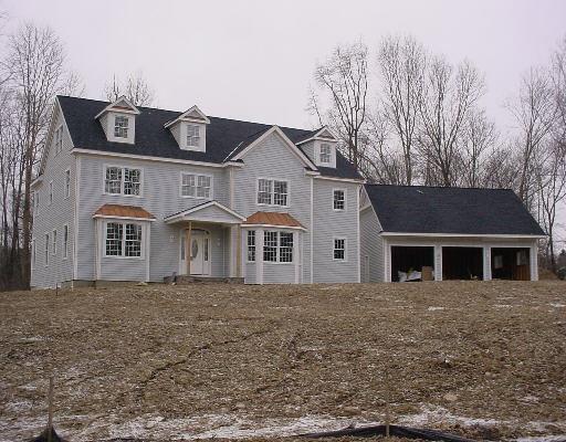 47 White Birch Road Ridgefield, CT 06877 - Photo 1 of 1 a front view of a house with a garden