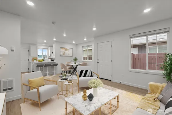 a living room with furniture and a table