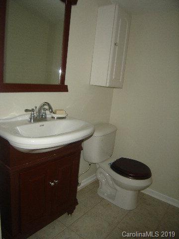 575 State Street Marion, NC 28752 - Photo 13 of 18 a bathroom with a sink and a toilet