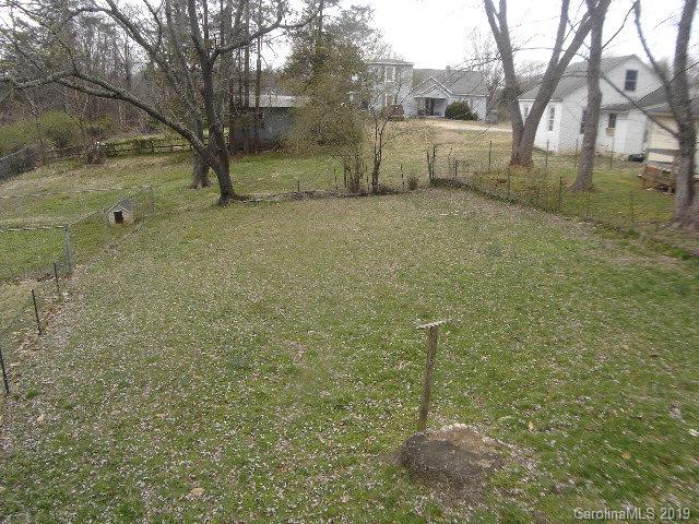 575 State Street Marion, NC 28752 - Photo 16 of 18 a backyard of a house with lots of green space