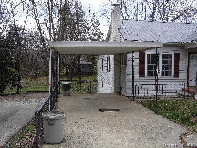575 State Street Marion, NC 28752 - Photo 18 of 18 a view of a house with backyard and porch