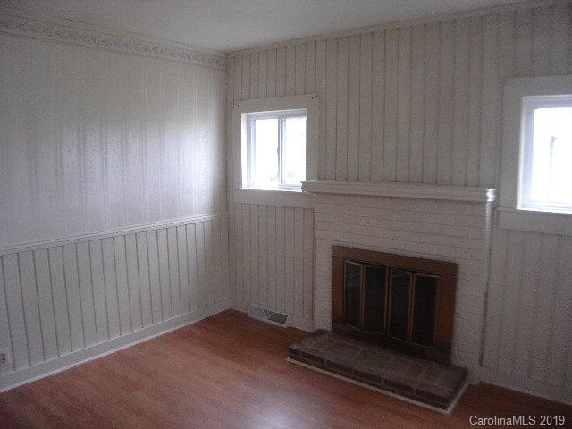 575 State Street Marion, NC 28752 - Photo 7 of 18 a living room with a fireplace
