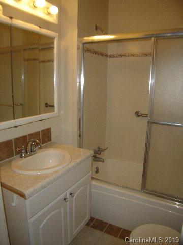 575 State Street Marion, NC 28752 - Photo 9 of 18 a bathroom with a sink and a mirror