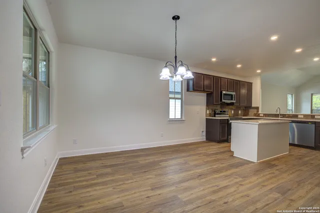 a view of a yard with a tree