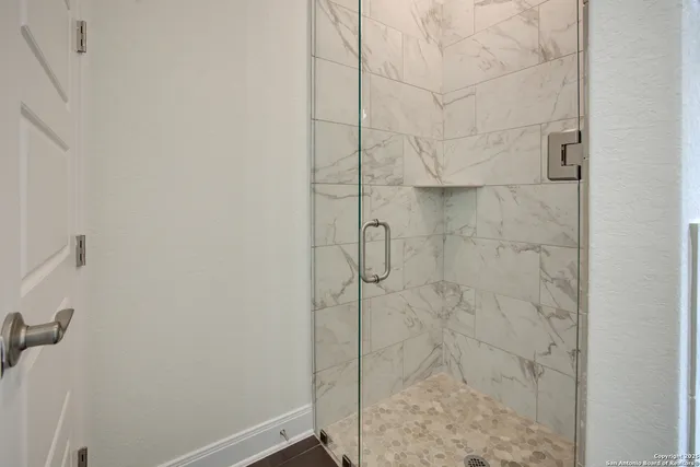 a white toilet sitting next to a bath tub