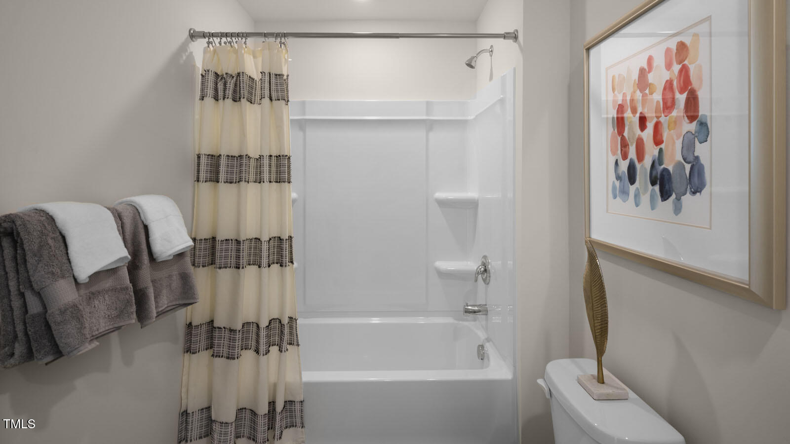 6005 Sodium Street Raleigh, NC 27610 - Photo 16 of 26 a bathroom with a bathtub and a shower