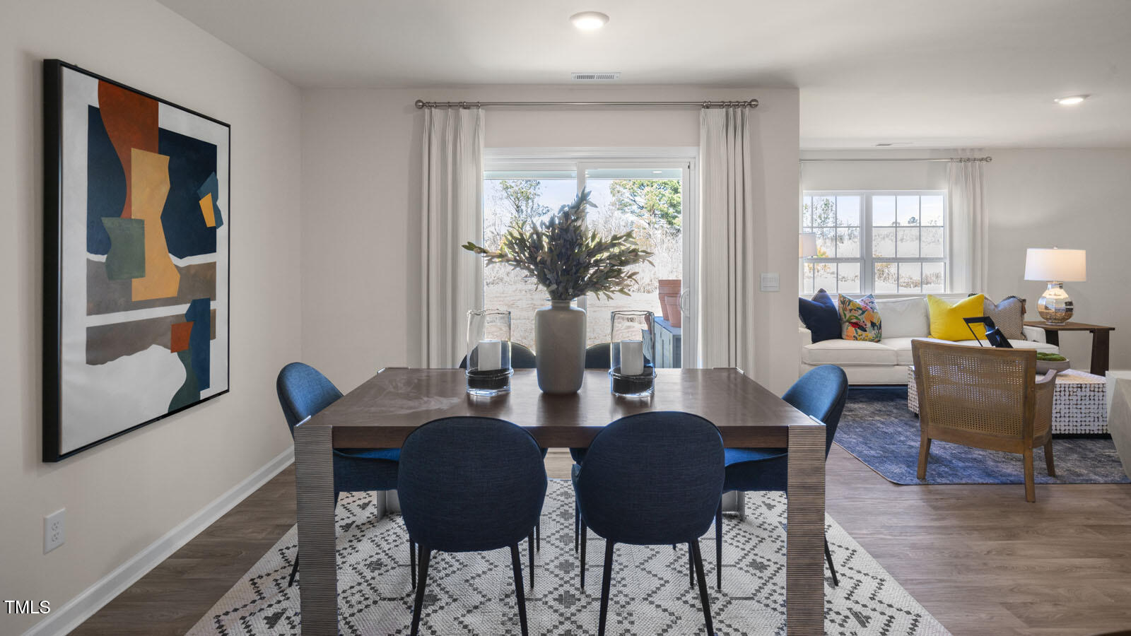 6005 Sodium Street Raleigh, NC 27610 - Photo 9 of 26 a dining room with furniture and wooden floor